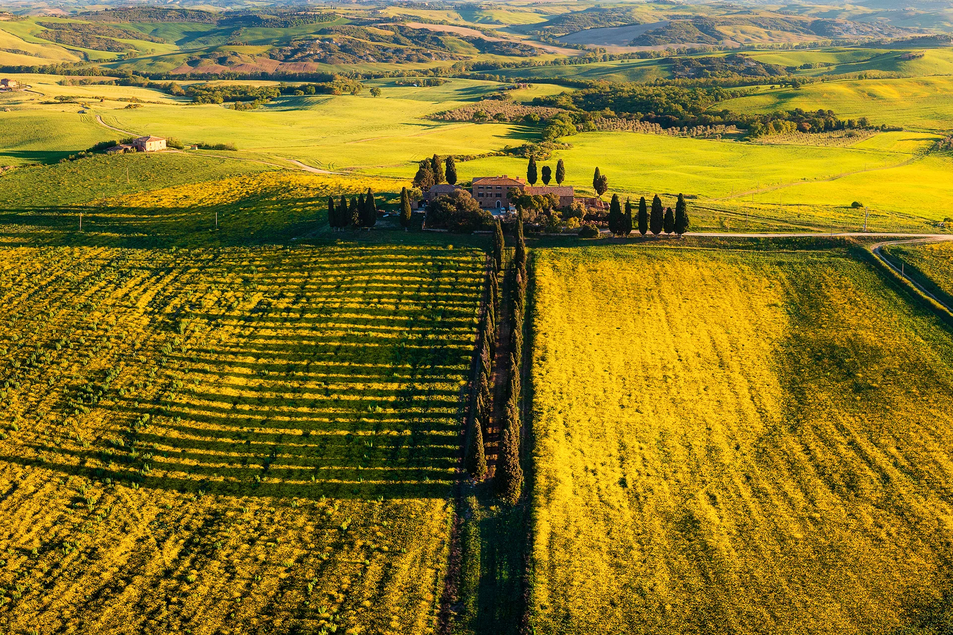 Aerial view of the stone houses, terracotta rooftops and medieval fortress of Castiglione d’Orcia in Tuscany.