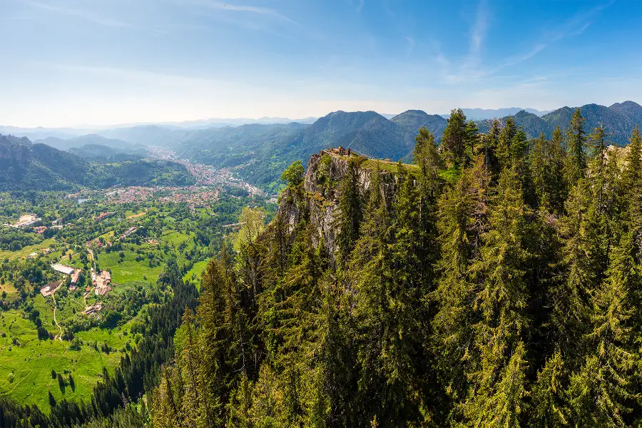 Panoramic view from Chervenata Skala over Smolyan and the forested ridges of the Rhodopes.