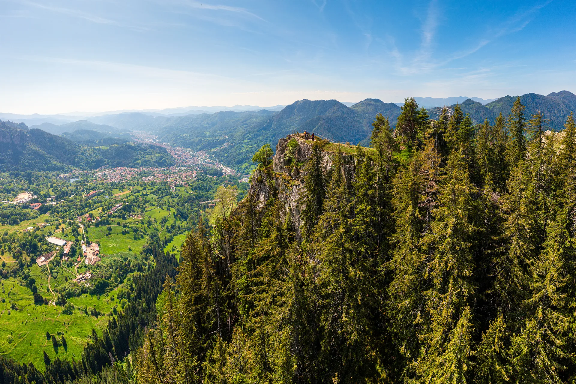Panoramic view from Chervenata Skala over Smolyan and the forested ridges of the Rhodopes.